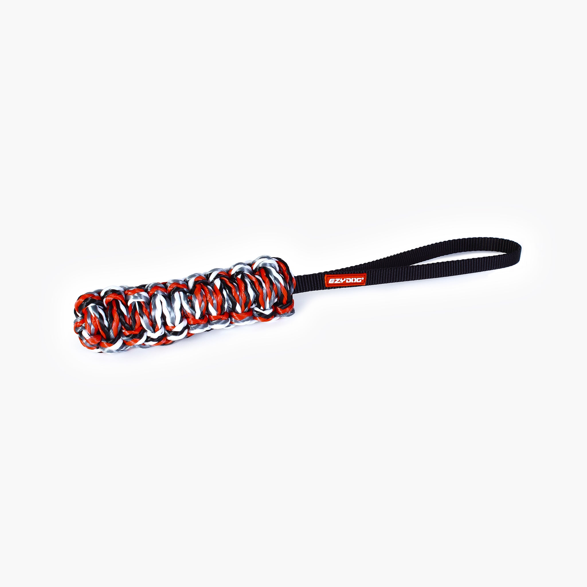 A red and black EzyDog Beaver Tail dog toy with a foam core and a handle for tug-of-war play.