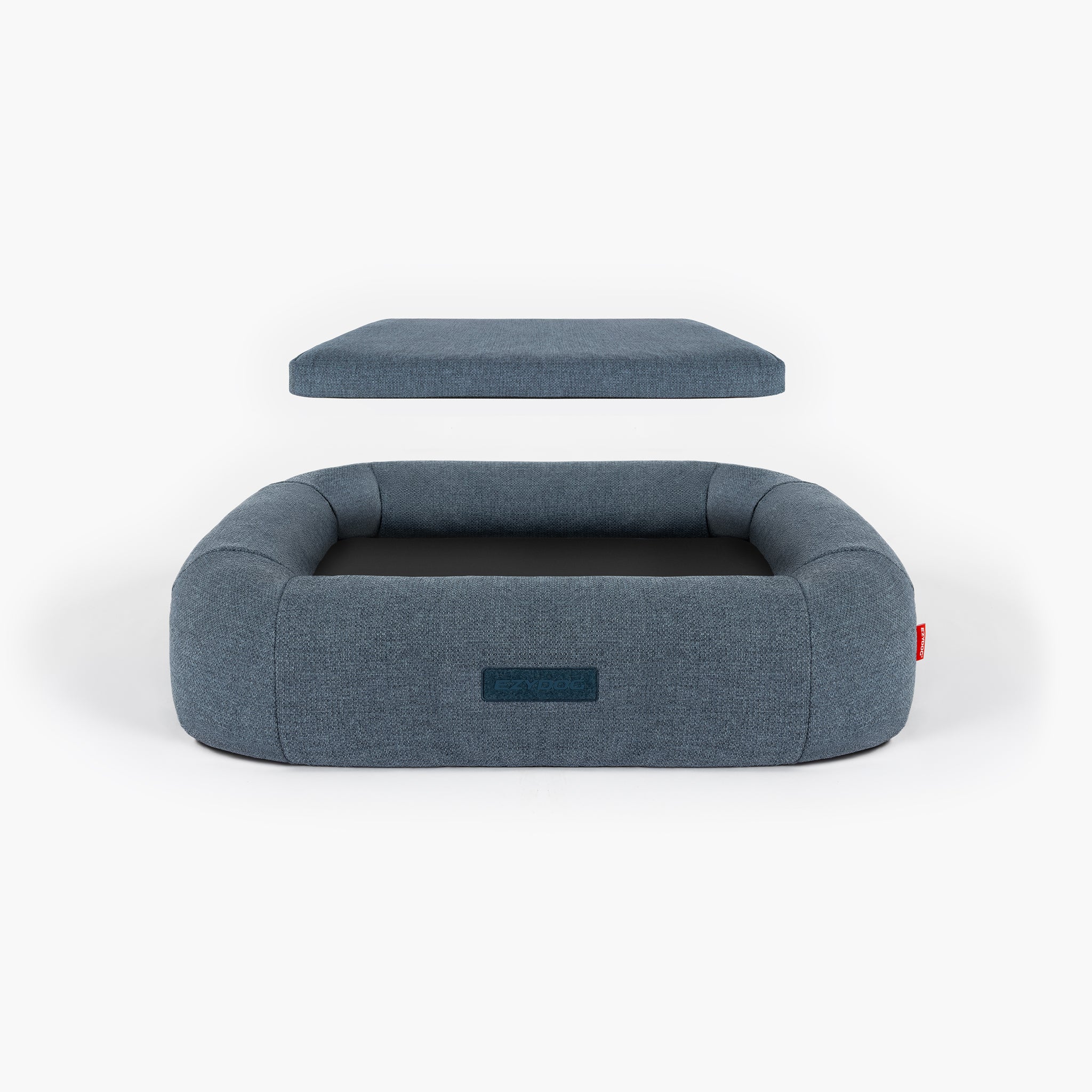 Blue pet bed with a detachable cushion on a white background