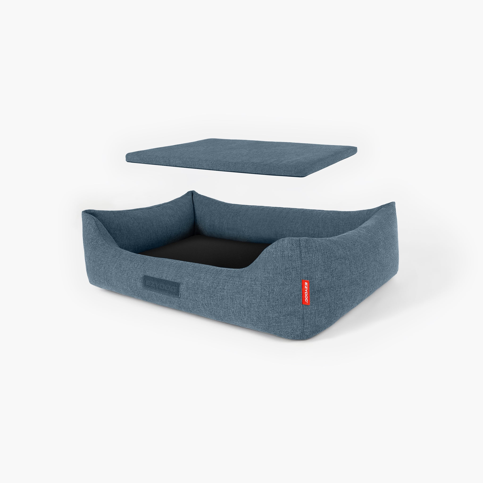 Blue dog bed with a red tag on a white background
