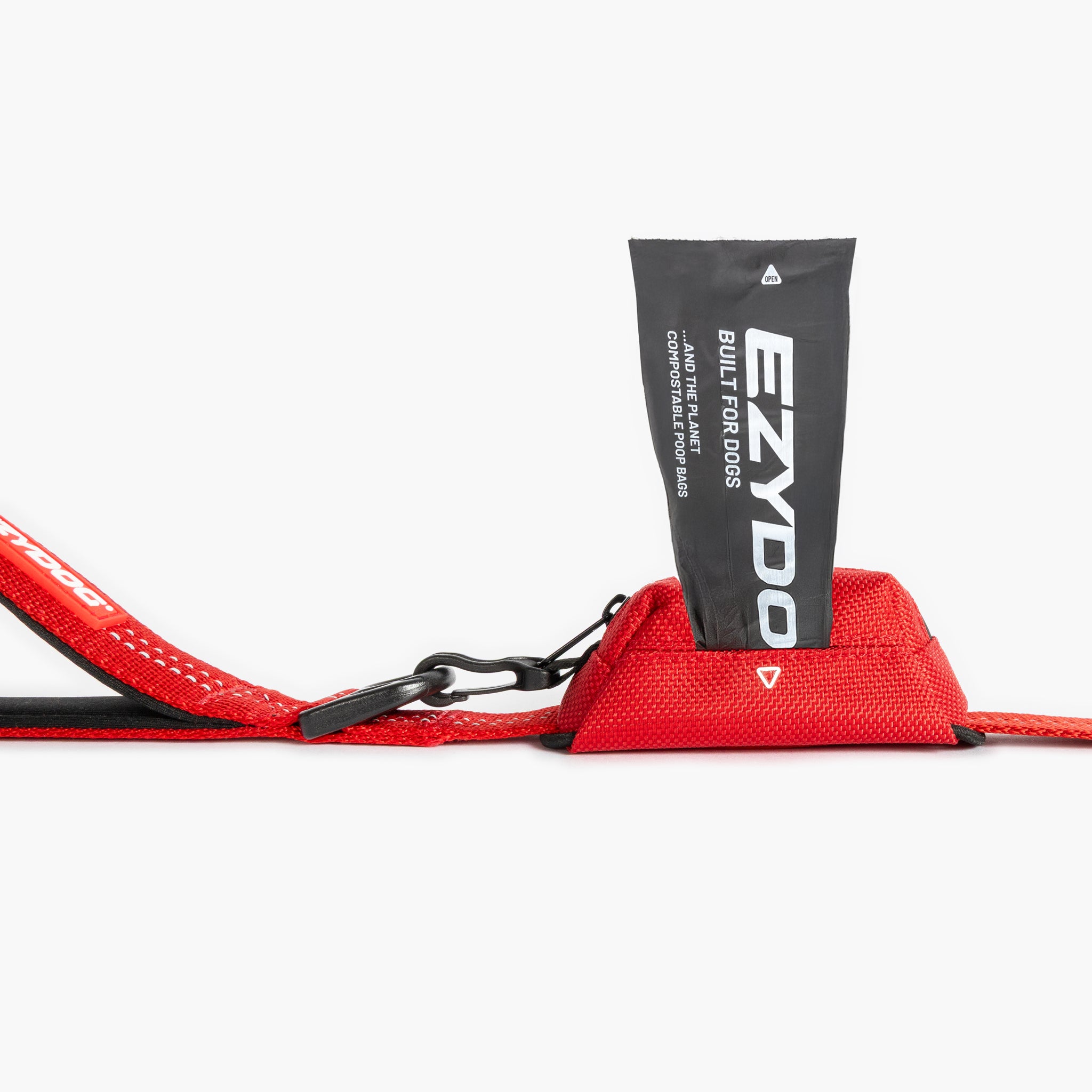 Red Essential Dog Poop Bag Holder with a black pouch labeled 'EZYDOG'