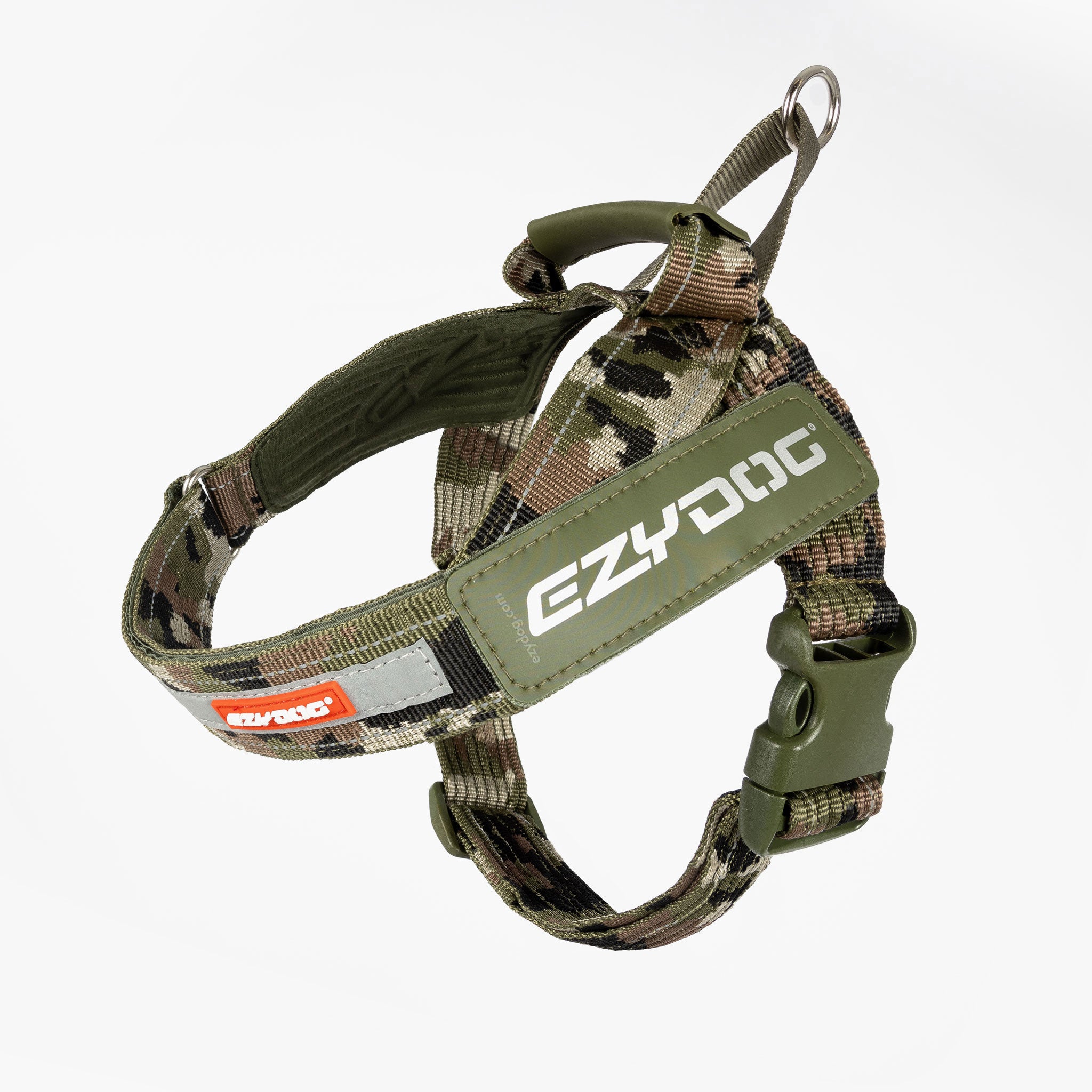 A camouflage-patterned dog harness with the EzyDog brand logo, featuring adjustable straps, a stainless steel D-ring, and reflective trim.