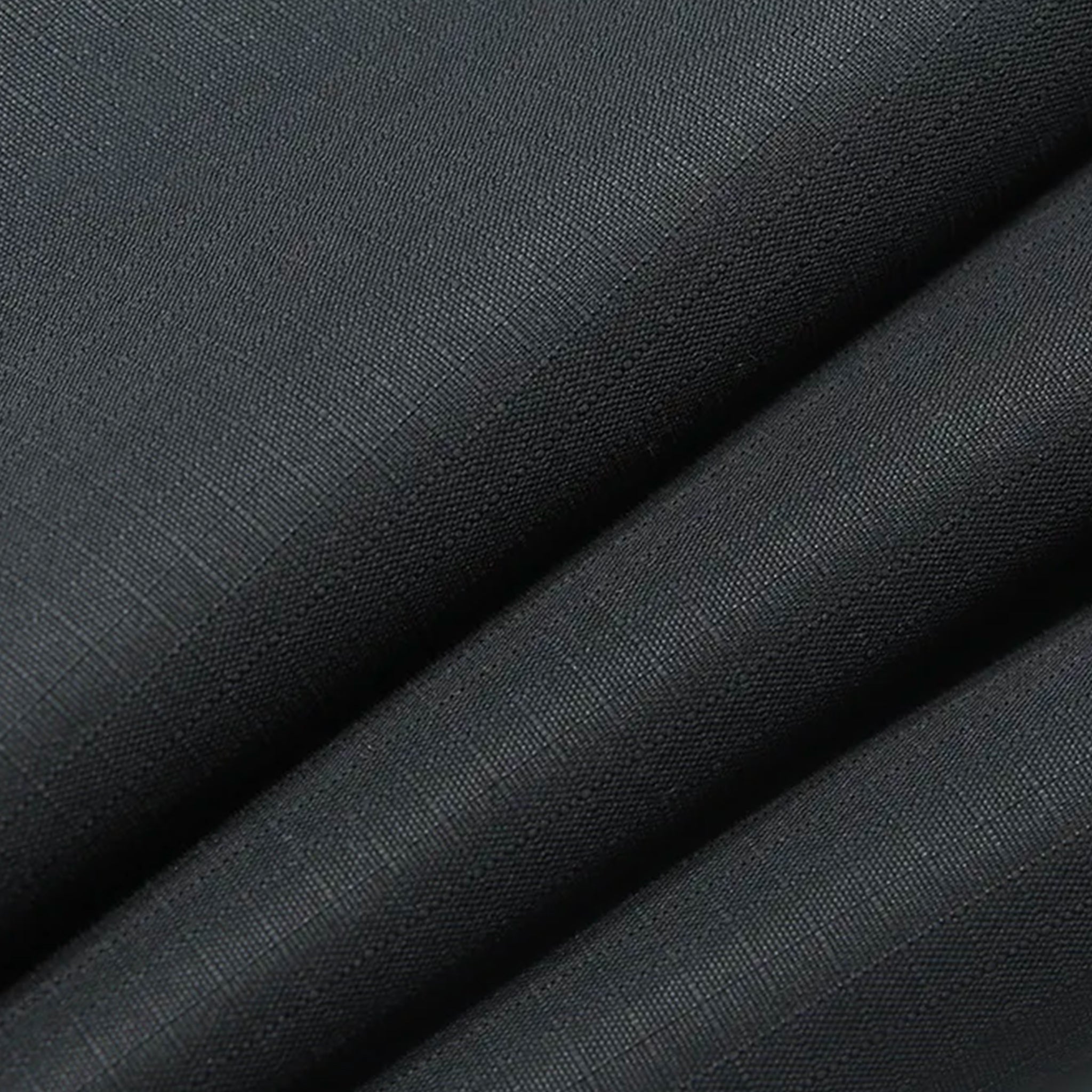 Dark gray fabric with a subtle texture