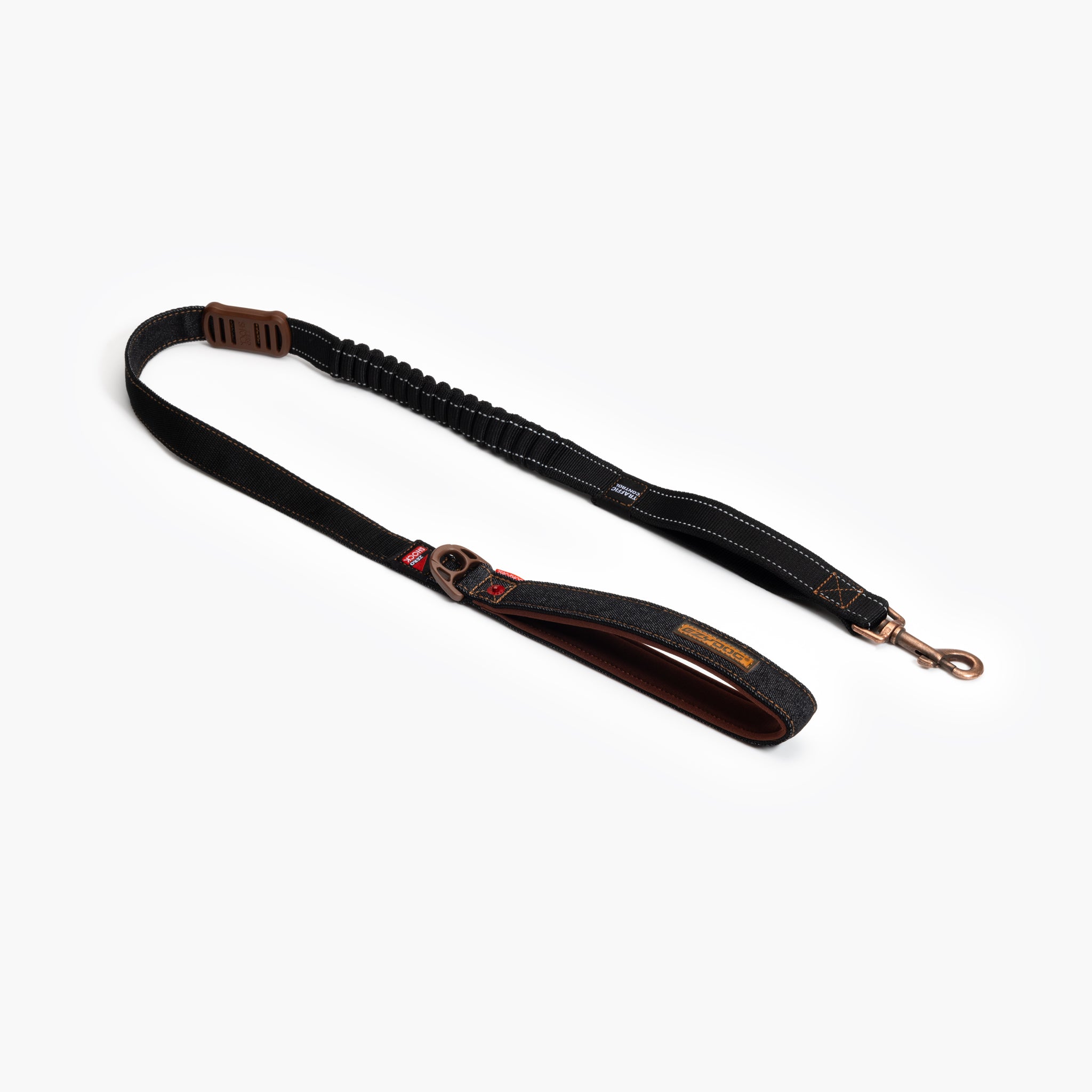 A denim blue dog leash with corrosion resistant hardware and soft touch webbing, featuring zero shock absorbing technology.