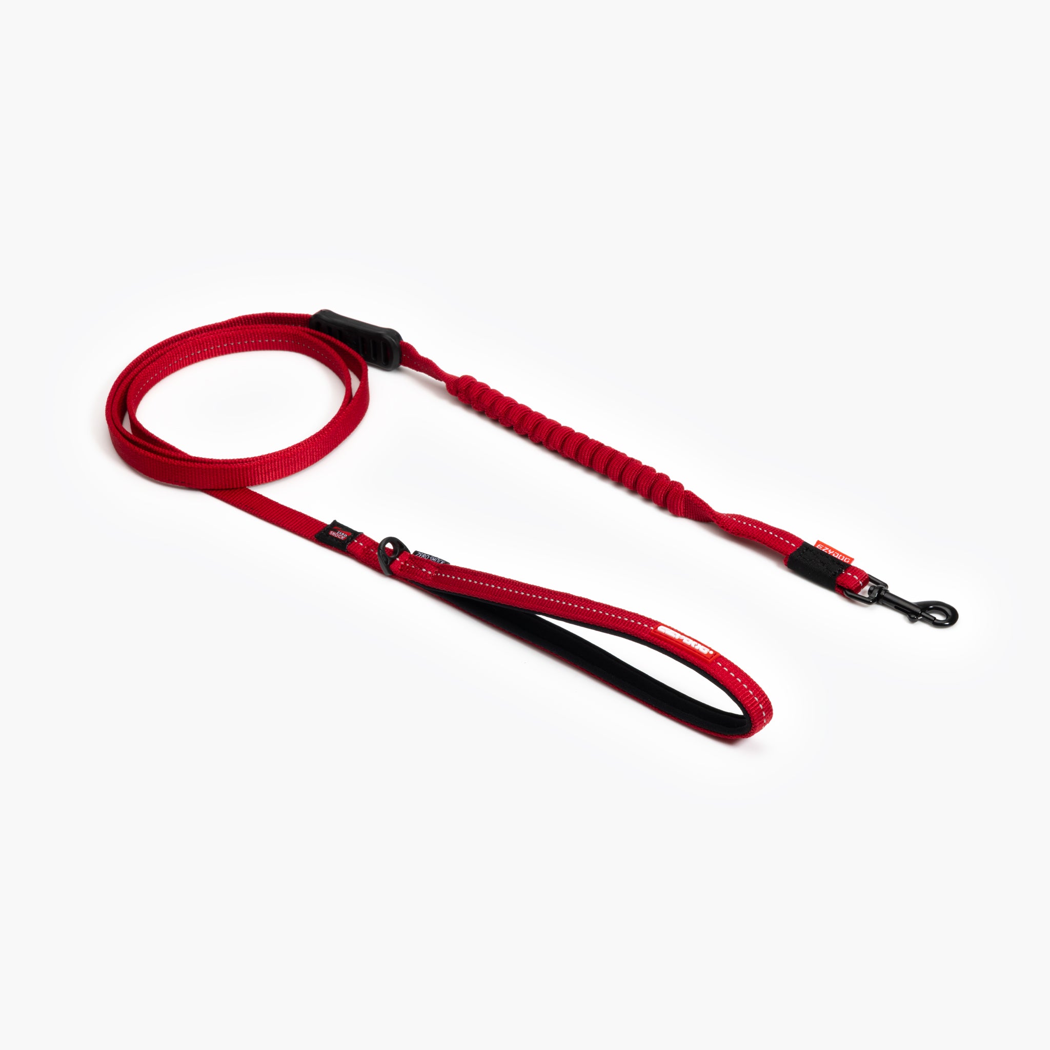 A red Zero Shock Leash LITE designed for smaller dogs, showing a shock-absorbing center and a neoprene lined handle.