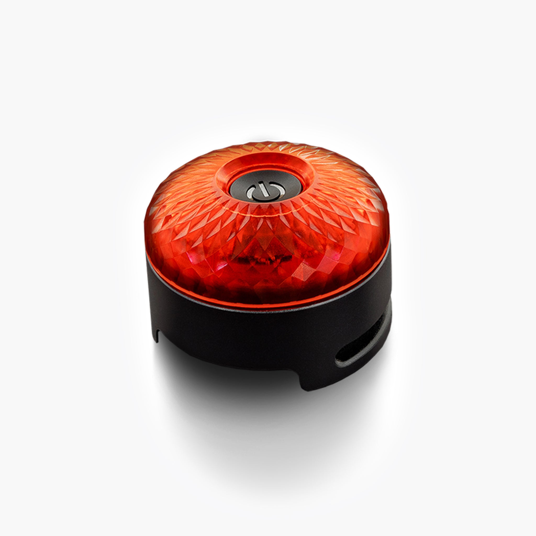 Close-up of EzyDog GO2 Dog Collar Light glowing red – LED safety light for dogs, waterproof and rechargeable