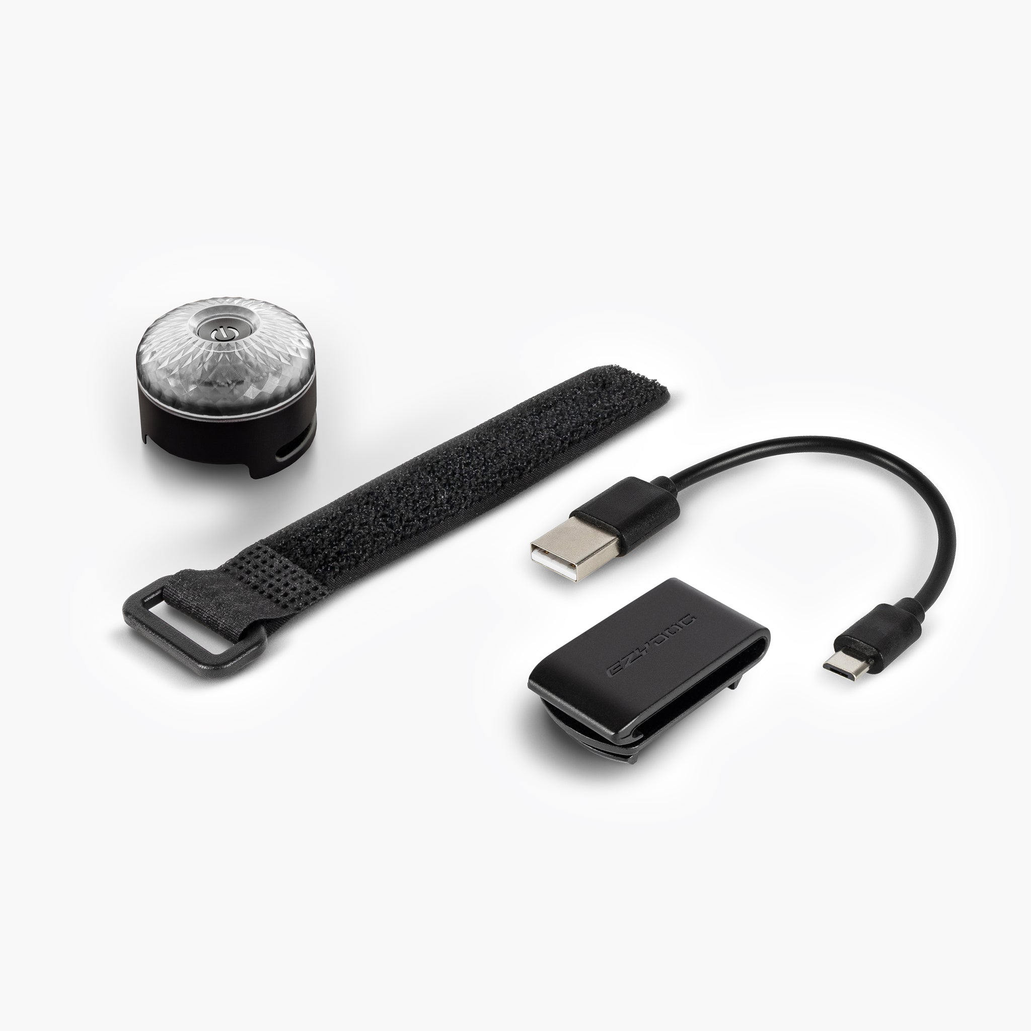 EzyDog GO2 Dog Light package contents – LED light, USB charging cable, nylon clip, and hook & loop strap