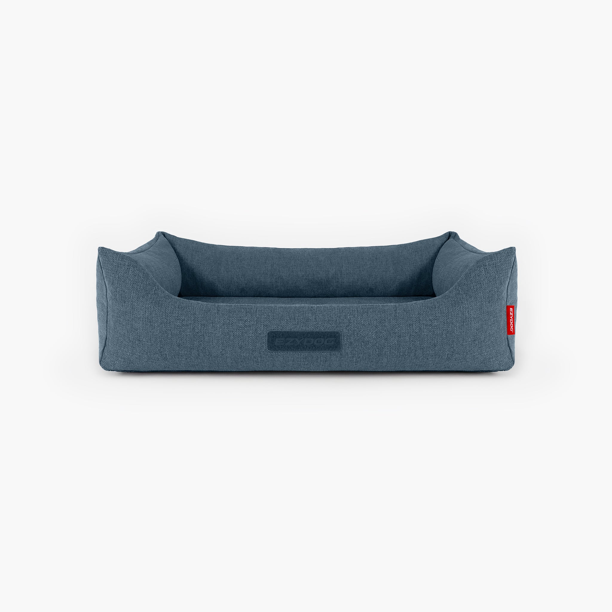 Blue dog bed with a red tag on a white background