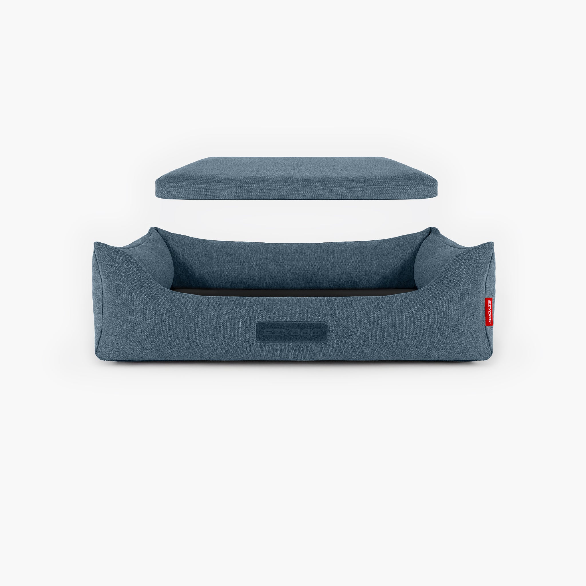 Blue dog bed with a cushion on a white background