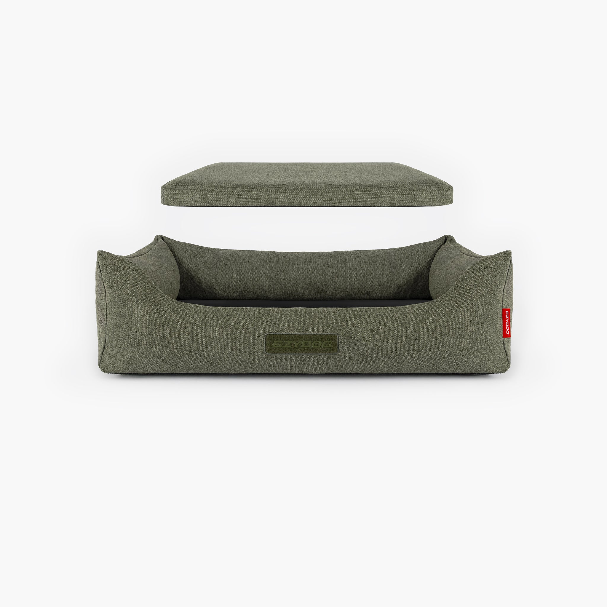 Green dog bed with a detachable cushion on a white background