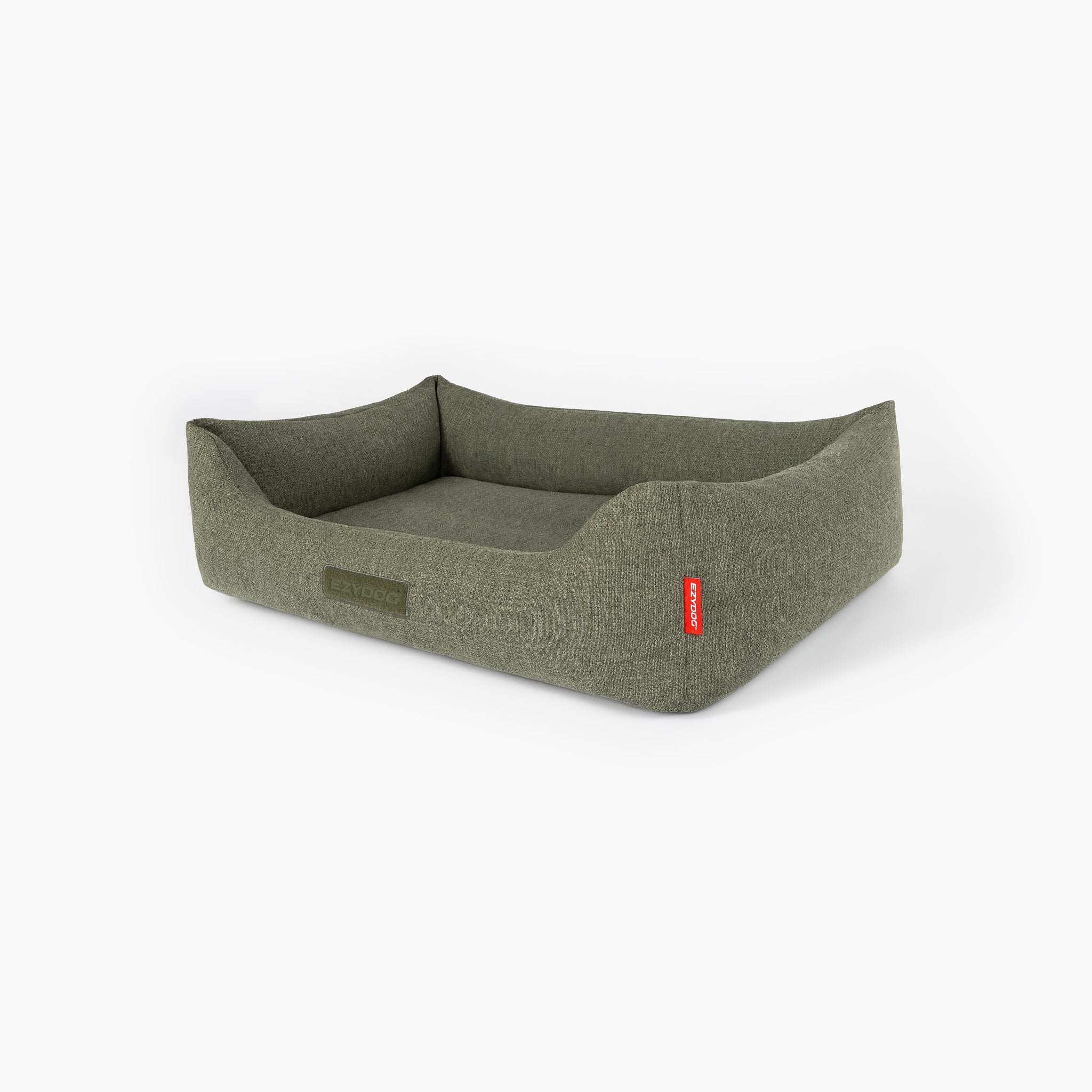 Green dog bed with a red tag on a white background