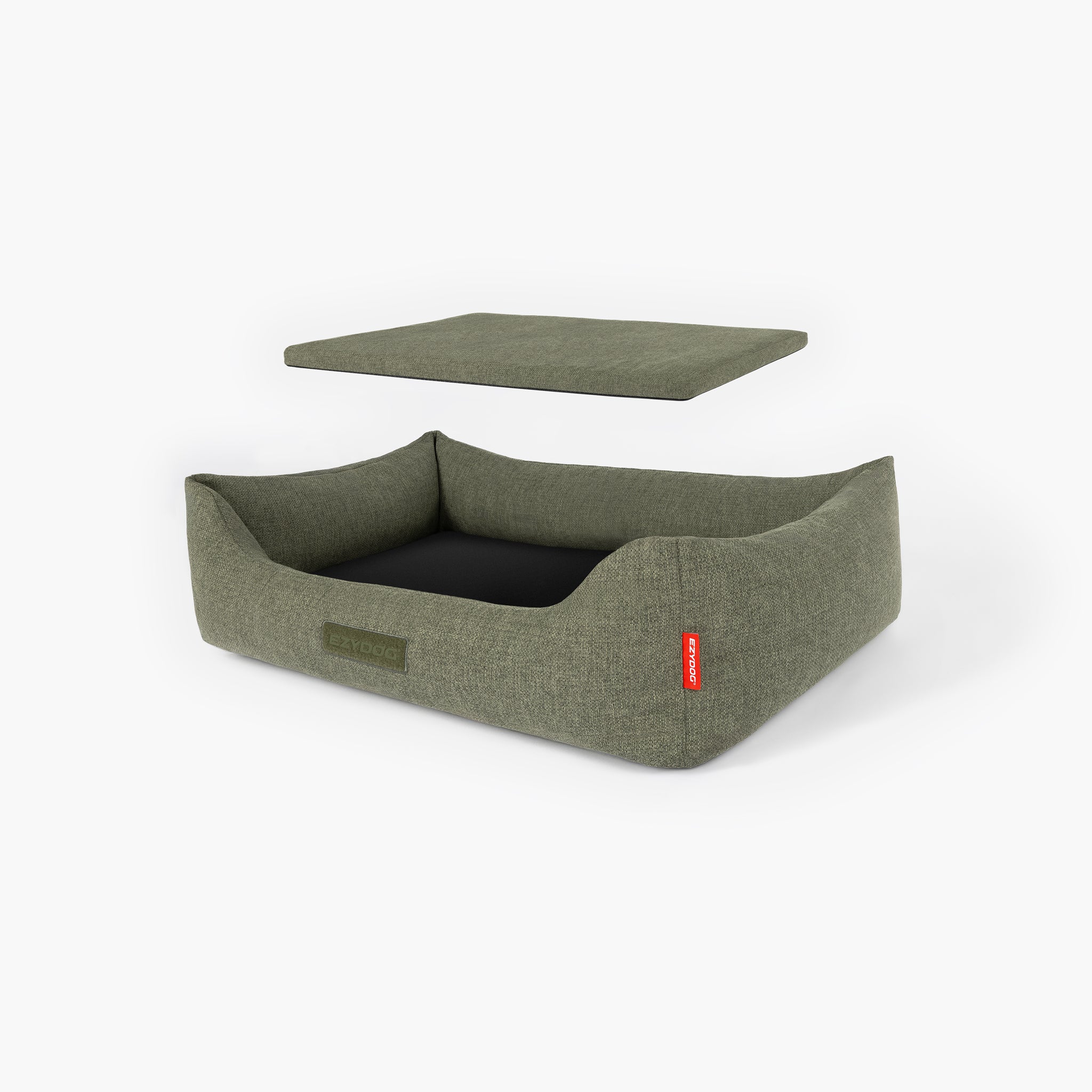 Green dog bed with a red tag on a white background