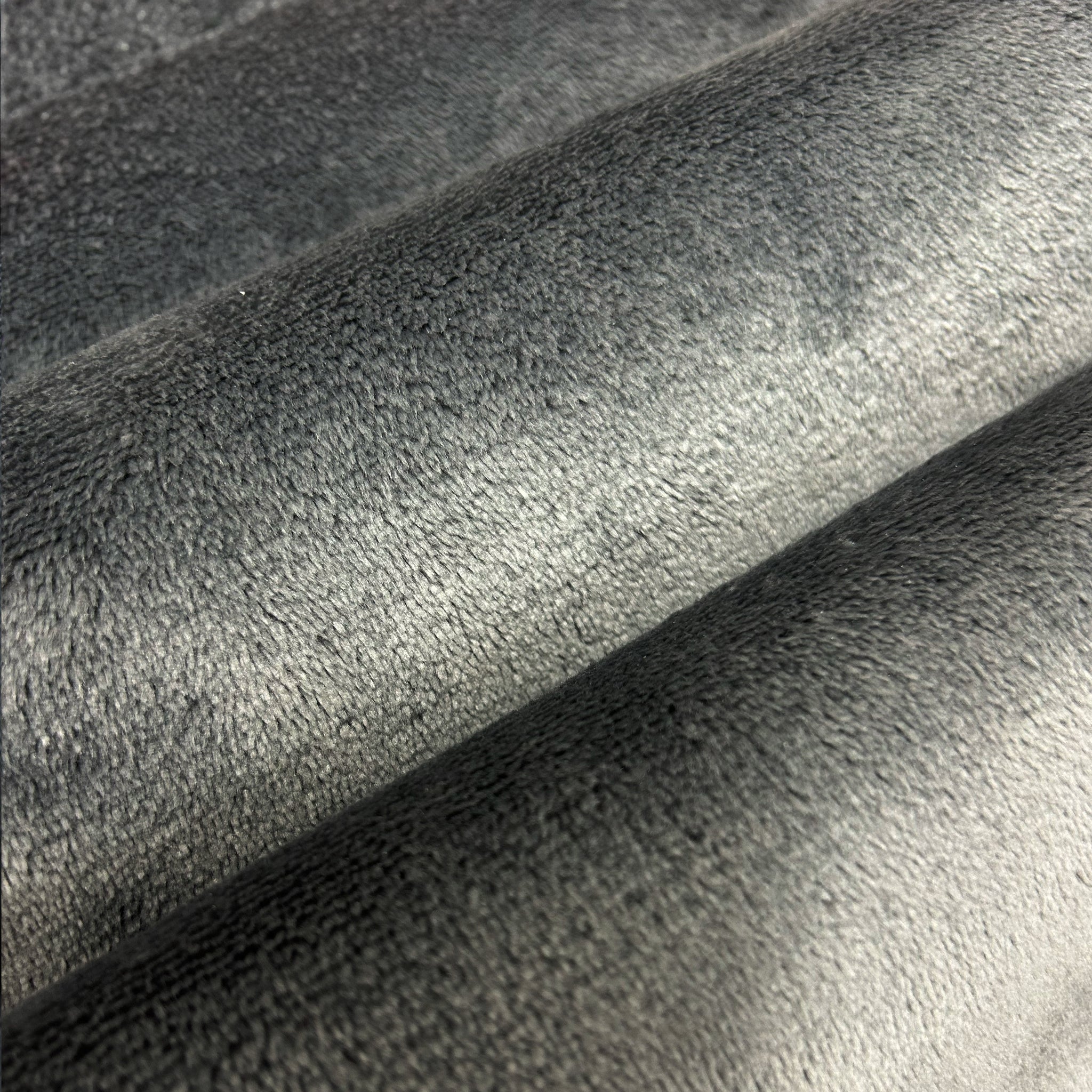 Close-up of gray textured fabric with a subtle pattern